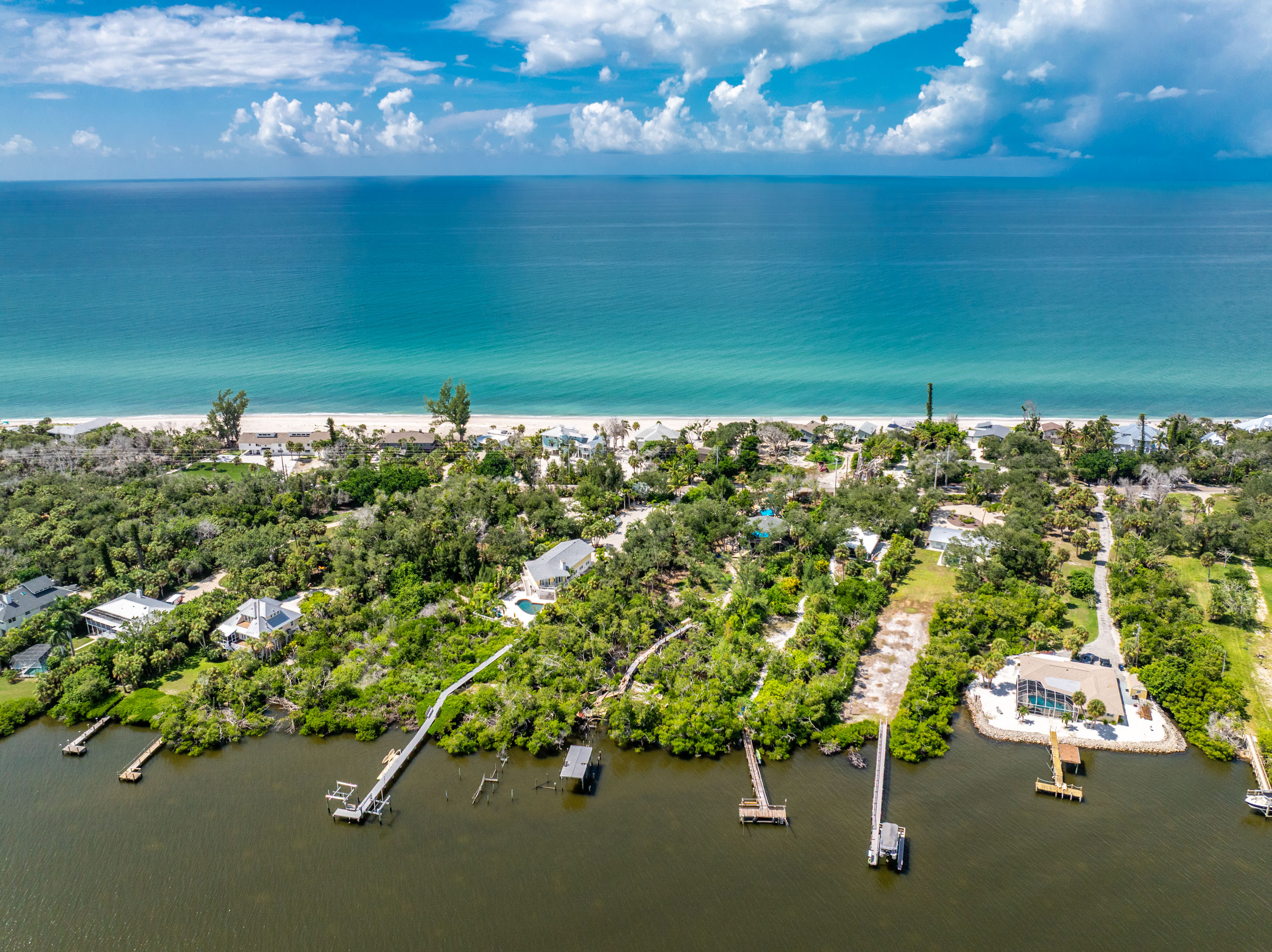 Aerial view of Manasota Key homes between the Gulf beach and bayside waterways